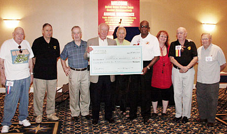 Florida chapter members at the National conference present a check to the USMCCCA Foundation. From left: Chuch Beveridge, Tom Kerr, Jack Paxton, Red Carpenter, Mawk Arnold, Don ONeal (Foundation President), Kate Stark, Bob McEwen, Hank Ehlbeck.