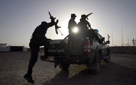 Pictorial Honorable Mention - Sgt. Ray Lewis: Afghan National Police trained by the Police Mentoring Teams of Task Force 2d Battalion, 7th Marine Regiment, Special Purpose Marine Air Ground Task Force Afghanistan, load into their police truck in Delaram, Afghanistan. The police are serving with the Marines of TF 2/7 who deployed to Afghanistan earlier this year to conduct counterinsurgency operations with an emphasis on police mentoring in support of Operation Enduring Freedom.