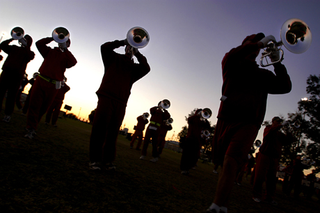 Pictorial Honorable Mention -  GySgt. Bill Lisbon: Musicians with the U.S. Marine Drum and Bugle Corps blast brass instruments during a late afternoon practice on the air station Tuesday. The Marines arrived in Yuma Saturday to tune up their routine in preparation for their 2008 tour, which kicks off Feb. 23 at the Yuma Air Show.