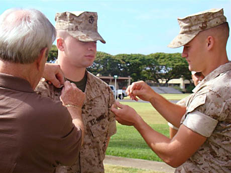 CC Jack Paxton and LCpl. Daniel Woodall help pin LCpl Colby Brown. Both Marine CCs are assigned to JPAO Kaneohe Bay, HI.