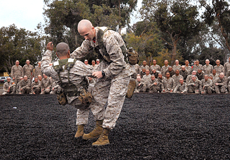 2nd Place Photojournalism by Sgt. James P.Green: Drill instructor Sgt. Brandon Guild, Platoon 1075, Company D, leg sweeps drill instructor Sgt. Mario Virto, Platoon 1069, while demonstrating proper techniques for the recruits. 