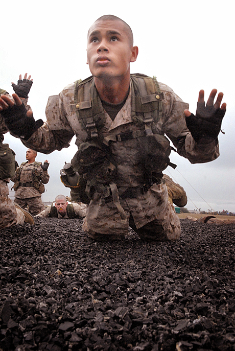 2nd Place Photojournalism by Sgt. James P.Green: Recruit Ianraymond R. Fleming, Platoon 1073, Company D, does a front break fall. This move is used to avoid injury to the head and face.