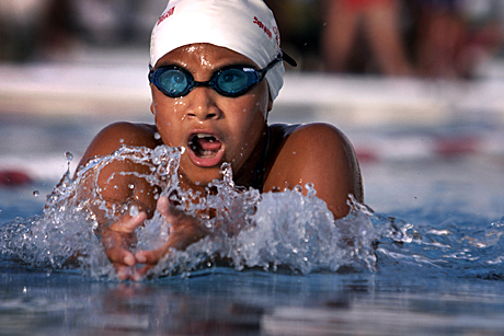 The Megan McClung Sports Photography Award Honorable Mention - LCpl. Stephanie Pupkiewicz: Laila K. Tate, member of the Okinawa Dolphins Swim Team, performs the breast stroke July 22 at the Camp Foster 50-meter pool during the 200-meter Individual Medley. The swim team competes locally and internationally all year long, and is open to Status of Forces Agreement personnel and local nationals who work on base. 